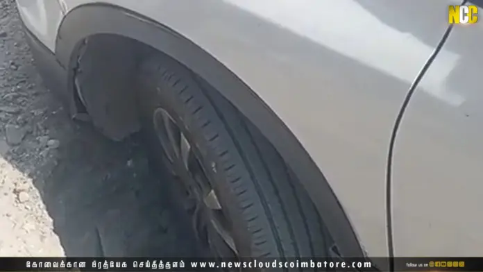 car stuck in sewer pit