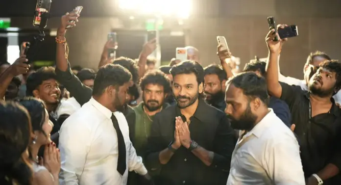 I'm addicted to your laughter.. Dhanush gushed to the actress on stage