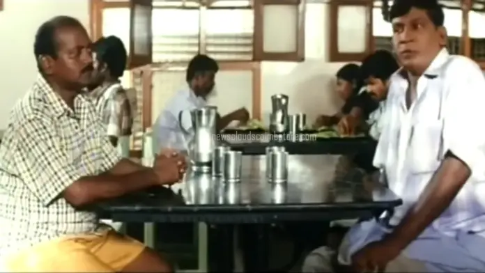 Two men sitting at a table.