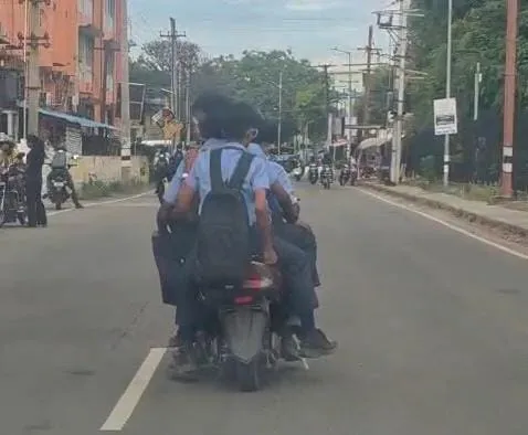 Four students on one bike