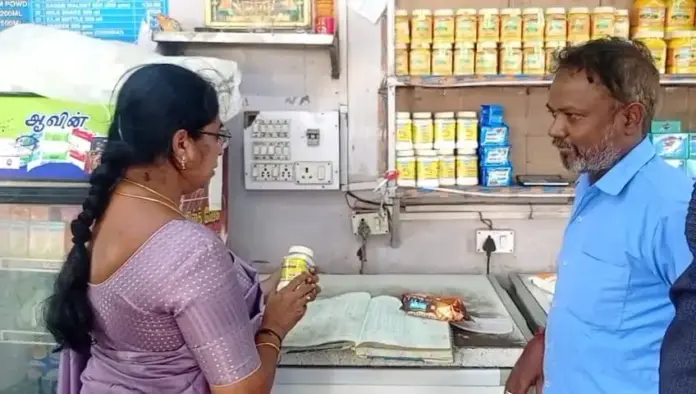 Minister Vijayalakshmi inspecting Aavin products at Gandhipuram outlet in Coimbatore.