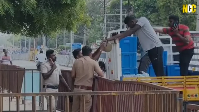 police personnel wait for food during Vijay's visit