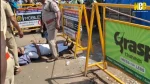 A visually impaired man lies on the road attempting to meet Chief Minister Vijay